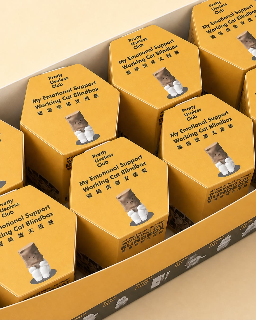 An opened Working Cat full-set box with eight yellow hexagonal blind boxes inside