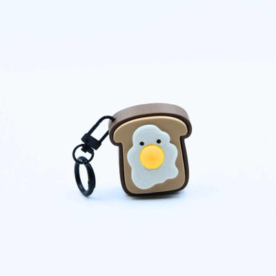 Toastie Meow Clicky Keychain set featuring cute cat faces on toast-shaped fidget keychains with different designs including Sunny Egg Toast and Plain Purrfect Toast.