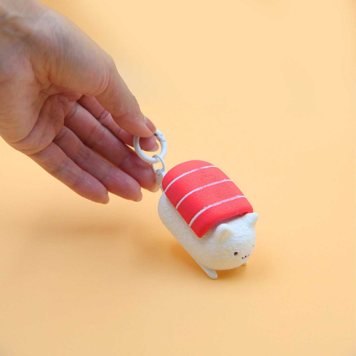 M.E.S.A. X Sushi Cat hand-finished 3D-printed tuna sushi cat figurines with red fish topping on beige display board