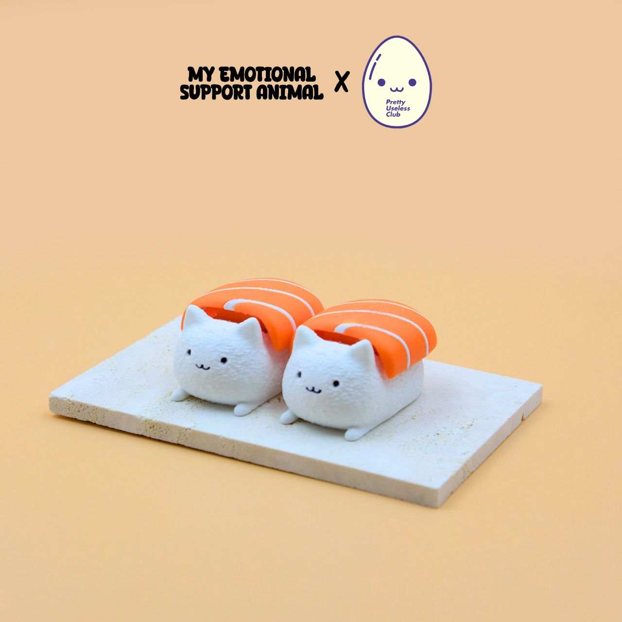 M.E.S.A. X Sushi Cat hand-finished 3D-printed cat figurines dressed as salmon sushi with keychains.