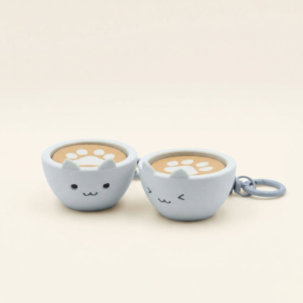 Cappuccino Meow Clicky Keychain with cat face and paw print latte art